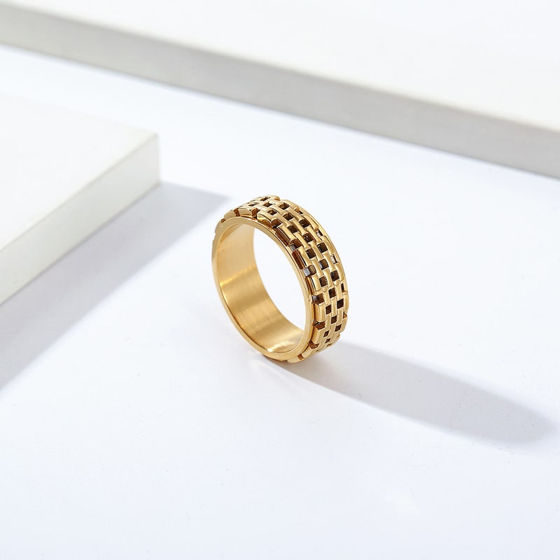 Bague anti-stress anneau tournant Muraille en coloris doré.