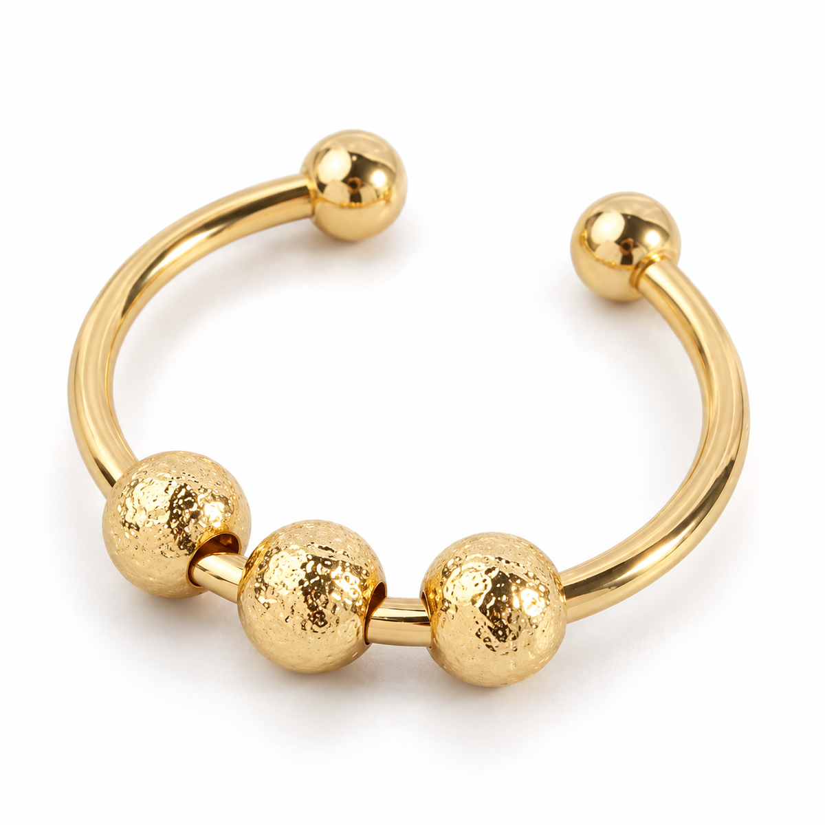 Bague anti-stress bille Grenue en coloris doré.