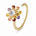 Bague anti-stress rotative Amas dorée, étoile de pierres multicolores autour d’une pierre claire, anneau torsadé