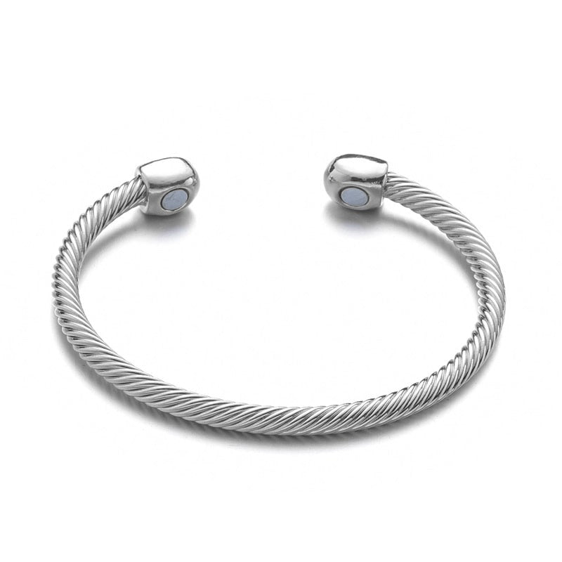 Bracelet magnétique Torsadé en coloris argenté.