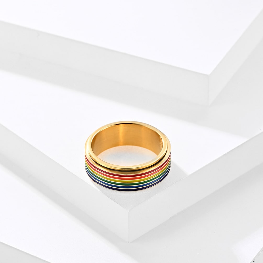 Bague anti-stress à anneau tournant arc-en-ciel couleur or.