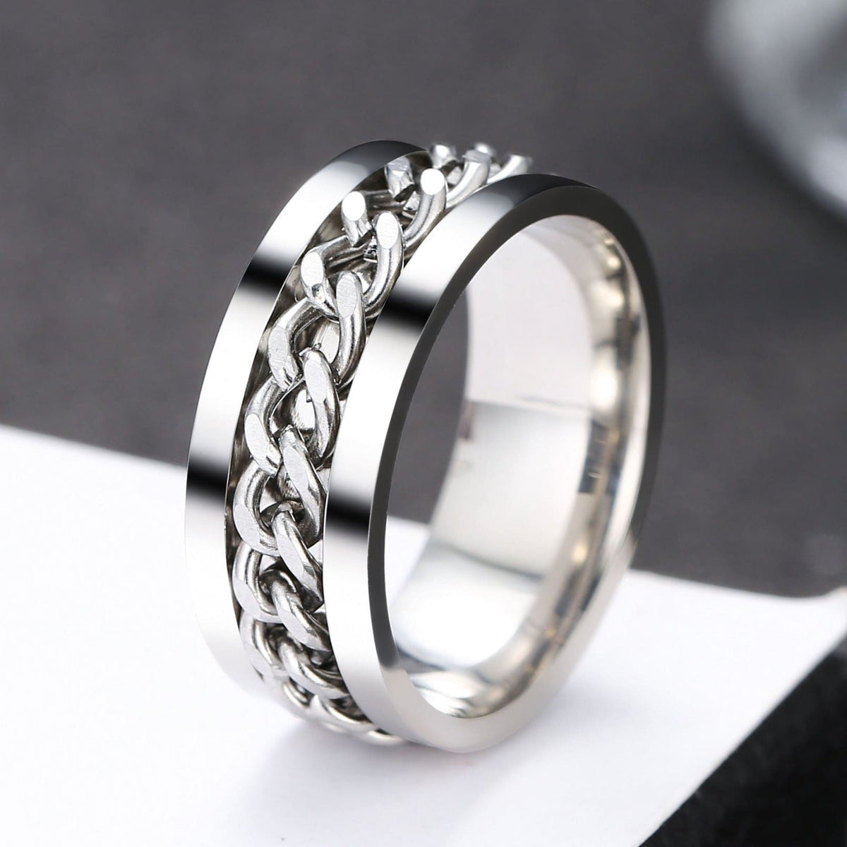 Bague anti-stress à anneau tournant Chaine Colorée argent.