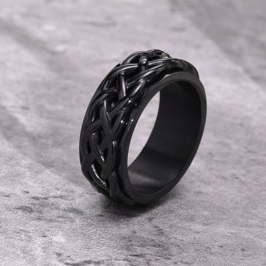 Bague anti-stress à anneau tournant Enchaîné couleur noire.